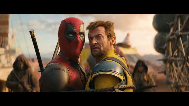 A screenshot of the final Deadpool &amp; Wolverine trailer, showing the two heroes tied together and staring just off camera at something in the distance.