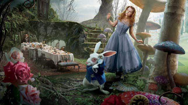 Alice stands with the white rabbit. 