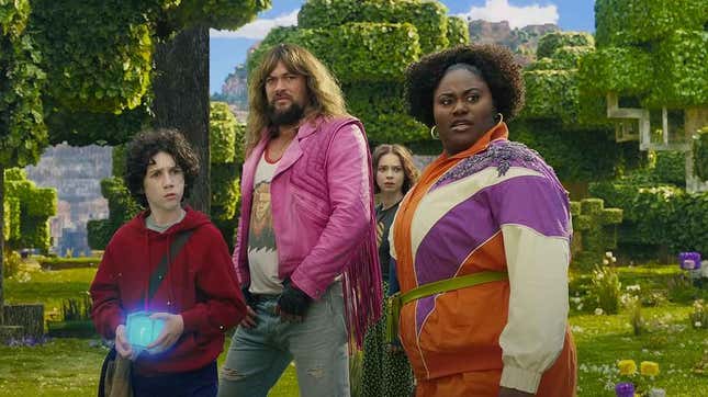 The cast of A Minecraft Movie, including Jason Momoa in a luscious wig, stand in a group shot