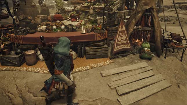 A screenshot of Monster Hunter Wilds showing the player character walking around the village hub area.